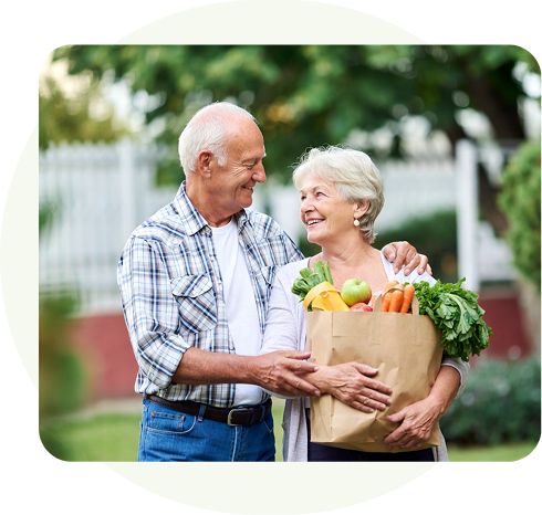 Seniors purchasing healthy groceries with their spending allowance from a CSNP plan